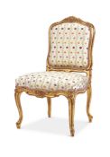 A GILTWOOD AND UPHOLSTERED SIDE CHAIR IN LOUIS XV STYLE