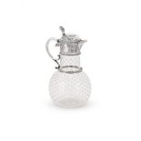A VICTORIAN SILVER MOUNTED AND GLASS CLARET JUG