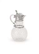 A VICTORIAN SILVER MOUNTED AND GLASS CLARET JUG
