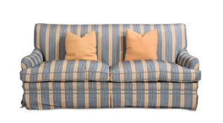 AN UPHOLSTERED SOFA IN THE MANNER OF HOWARD & SONS