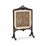 A LATE VICTORIAN CARVED MAHOGANY FIRE SCREEN CIRCA 1890