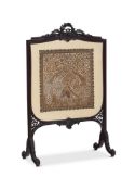 A LATE VICTORIAN CARVED MAHOGANY FIRE SCREEN CIRCA 1890