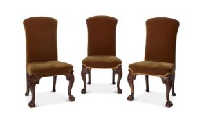 A SET OF THREE CARVED WALNUT AND UPHOLSTERED SIDE CHAIRS IN GEORGE II STYLE