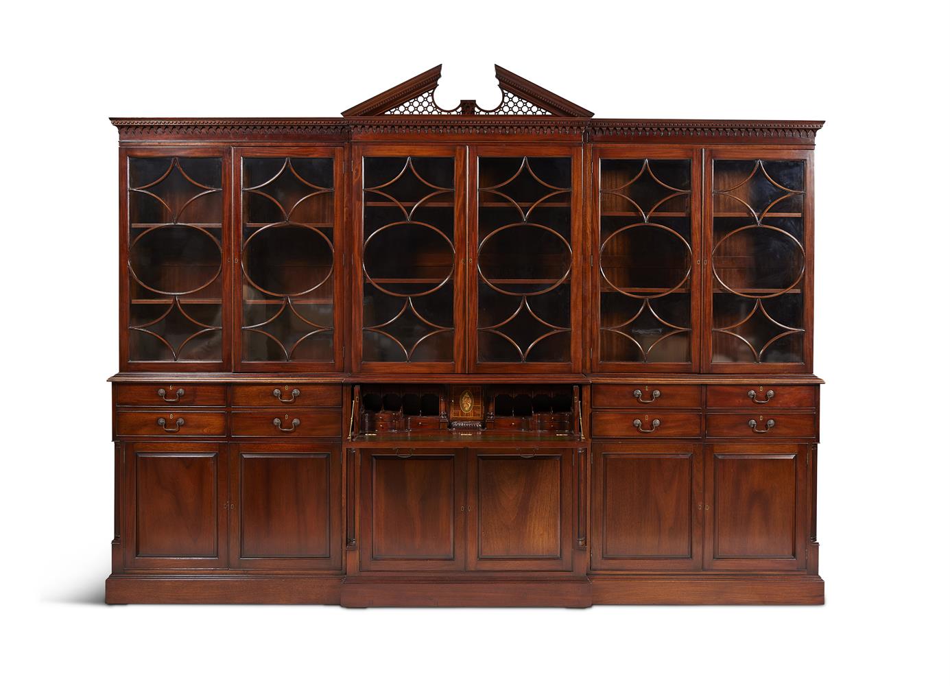 A MAHOGANY BREAKFRONT LIBRARY BOOKCASE IN GEORGE III STYLE