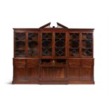 A MAHOGANY BREAKFRONT LIBRARY BOOKCASE IN GEORGE III STYLE