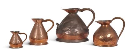 A GROUP OF FOUR GRADUATED COPPER MEASURING JUGS, MOSTLY 19TH CENTURY
