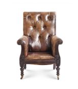 AN EARLY VICTORIAN MAHOGANY AND BUTTONED LEATHER UPHOLSTERED LIBRARY ARMCHAIR MID 19TH CENTURY