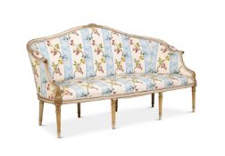 A GEORGE III CREAM PAINTED , PARCEL GILT AND UPHOLSTERED SETTEE CIRCA 1790