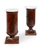 A MATCHED PAIR OF FRENCH MAHOGANY AND MARBLE TOPPED PEDESTAL BEDSIDE CABINETS CIRCA 1840