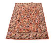 A MACHINE WOVEN RUG IN NORTH WEST PERSIAN STYLE