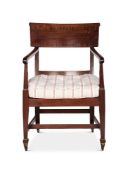 A GEORGE III MAHOGANY AND CROSSBANDED LIBRARY ARMCHAIR BY THOMAS CHIPPENDALE THE YOUNGER (1749-1822