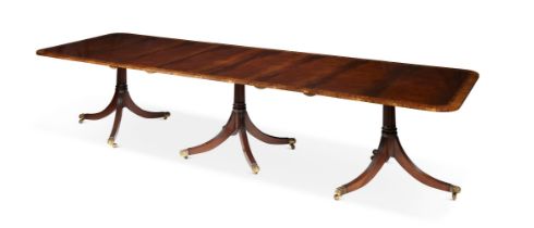 A MAHOGANY AND SATINWOOD CROSSBANDED TRIPLE PEDESTAL DINING TABLE IN GEORGE III STYLE