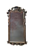 A BLACK LACQUER AND PARCEL GILT WALL MIRROR IN GEORGE II STYLE, 20TH CENTURY