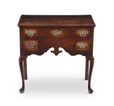 A GEORGE III OAK SIDE TABLE, CIRCA 1750