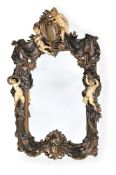 A CONTINENTAL PAINTED COMPOSITION WALL MIRROR, EARLY 20TH CENTURY