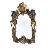 A CONTINENTAL PAINTED COMPOSITION WALL MIRROR, EARLY 20TH CENTURY
