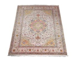 A TABRIZ PART SILK RUG