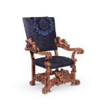 AN ITALIAN CARVED WALNUT OPEN ARMCHAIR, IN THE MANNER OF ANDREA BRUSTOLON, 19TH CENTURY