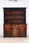 AN OAK DRESSER COMPRISING ASSOCIATED MID 18TH CENTURY AND LATER ELEMENTS