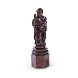 A CARVED OAK FIGURE OF A BISHOP SAINT, EARLY 17TH CENTURY