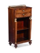 Y A REGENCY ROSEWOOD AND GILT METAL MOUNTED BOOKCASE IN EGYPTIAN REVIVAL TASTE, CIRCA 1820