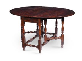 A GEORGE II YEW GATELEG TABLE, CIRCA 1730