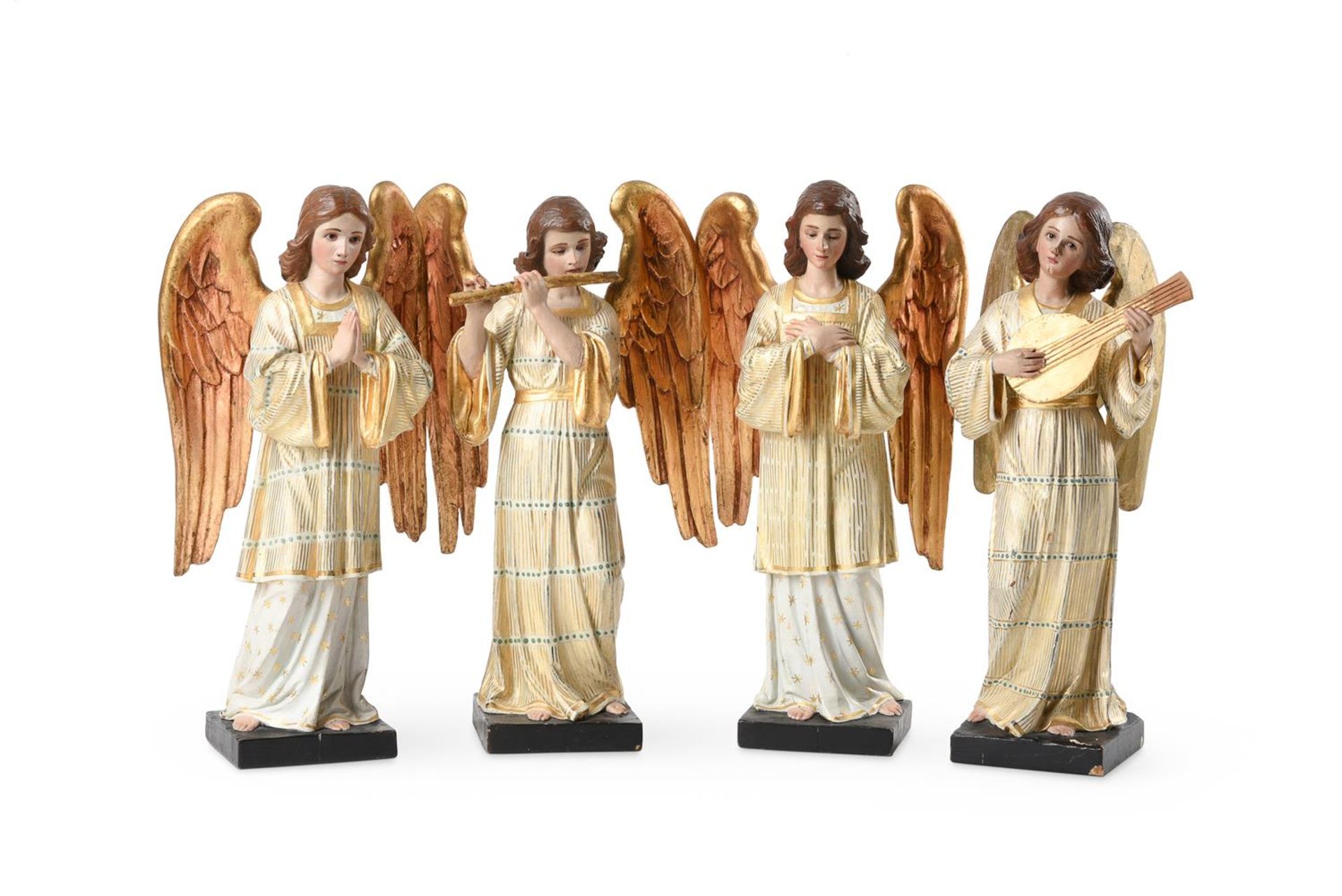 A SET OF FOUR CARVED, PAINTED AND PARCEL GILT SOFTWOOD FIGURES OF ANGELS, LATE 20TH CENTURY