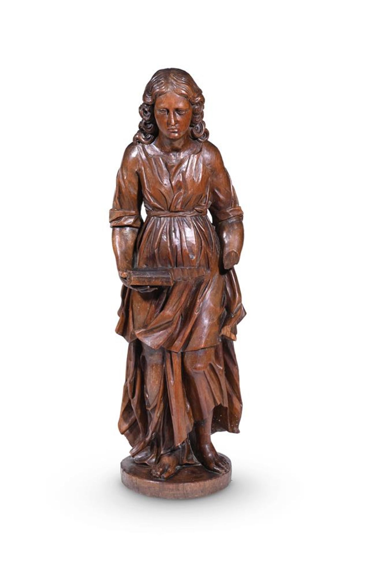 A NORTH EUROPEAN CARVED WALNUT FIGURE OF A WOMAN, LATE 17TH OR EARLY 18TH CENTURY