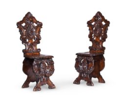 A PAIR OF ITALIAN WALNUT HALL CHAIRS, LATE 19TH CENTURY