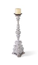 A WHITE PAINTED AND PARCEL GILTWOOD PRICKET CANDLESTICK, 18TH CENTURY