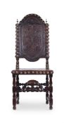 AN IBERIAN WALNUT AND LEATHER UPHOLSTERED SIDE CHAIR, LATE 1TH CENTURY