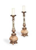 A PAIR OF PAINTED AND PARCEL GILTWOOD ALTAR CANDLESTICKS, 20TH CENTURY