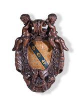 A CARVED OAK ARMORIAL PANEL IN THE BAROQUE TASTE, 19TH CENTURY