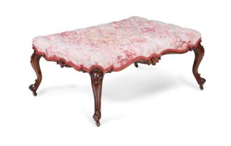 A VICTORIAN WALNUT AND BUTTON UPHOLSTERED CENTRE STOOL, CIRCA 1870