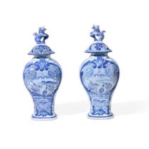 A PAIR OF DUTCH DELFT CHINOISERIE BALUSTER VASES AND COVERS WITH LION FINIALS, CIRCA 1900