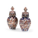 A PAIR OF JAPANESE IMARI BALUSTER VASES AND COVERS, MEIJI OR TAISHO PERIOD