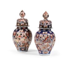 A PAIR OF JAPANESE IMARI BALUSTER VASES AND COVERS, MEIJI OR TAISHO PERIOD