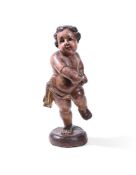 A CARVED AND POLYCHROME PRANCING CHERUB, POSSIBLY GERMAN, 18TH CENTURY