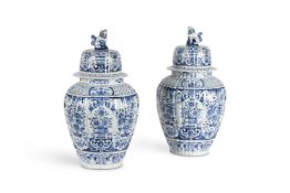 A PAIR OF DUTCH DELFT BLUE AN WHITE CHINOISERIE BALUSTER VASES AND COVERS, CIRCA 1900
