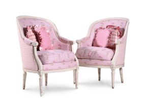 A PAIR OF WHITE PAINTED AND PINK UPHOLSTERED ARMCHAIRS IN FRENCH TASTE, 20TH CENTURY