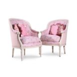 A PAIR OF WHITE PAINTED AND PINK UPHOLSTERED ARMCHAIRS IN FRENCH TASTE, 20TH CENTURY