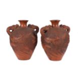 A LARGE PAIR OF JAPANESE TOKONAME RED CLAY DRAGON VASES