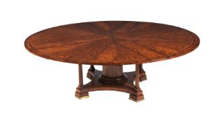 A MAHOGANY EXTENDING DINING TABLE AFTER THE JUPE MODEL