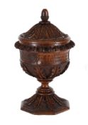 A HISTORIOLOGICAL CARVED OAK CUP AND COVER