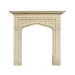 A SMALL CARVED LIMESTONE FIRE SURROUND