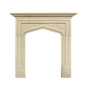 A SMALL CARVED LIMESTONE FIRE SURROUND