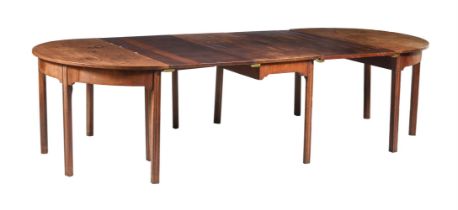 A GEORGE III MAHOGANY DINING TABLE