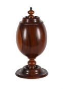 A LARGE TURNED LIGNUM VITAE CUP AND COVER