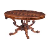 A VICTORIAN CARVED AND FIGURED WALNUT CENTRE TABLE