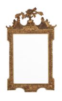 A GILTWOOD WALL MIRROR IN GEORGE III STYLE